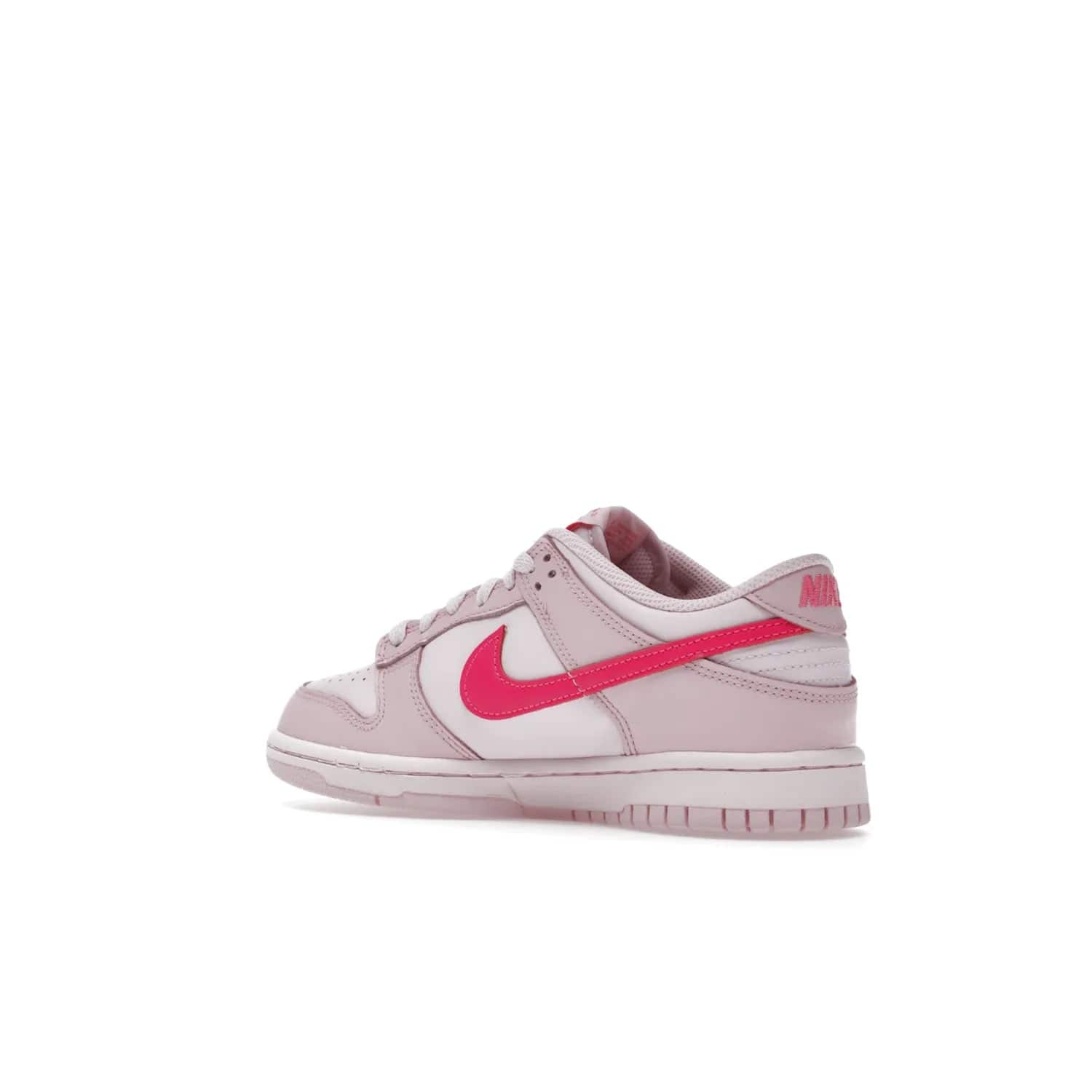 Nike Dunk Low Triple Pink (GS) - Image 23 - Only at www.BallersClubKickz.com - The Nike Dunk Low Triple Pink provides bold style in GS sizing. Featuring 3 distinct shades of pink and Nike branding, the shoe stands out.